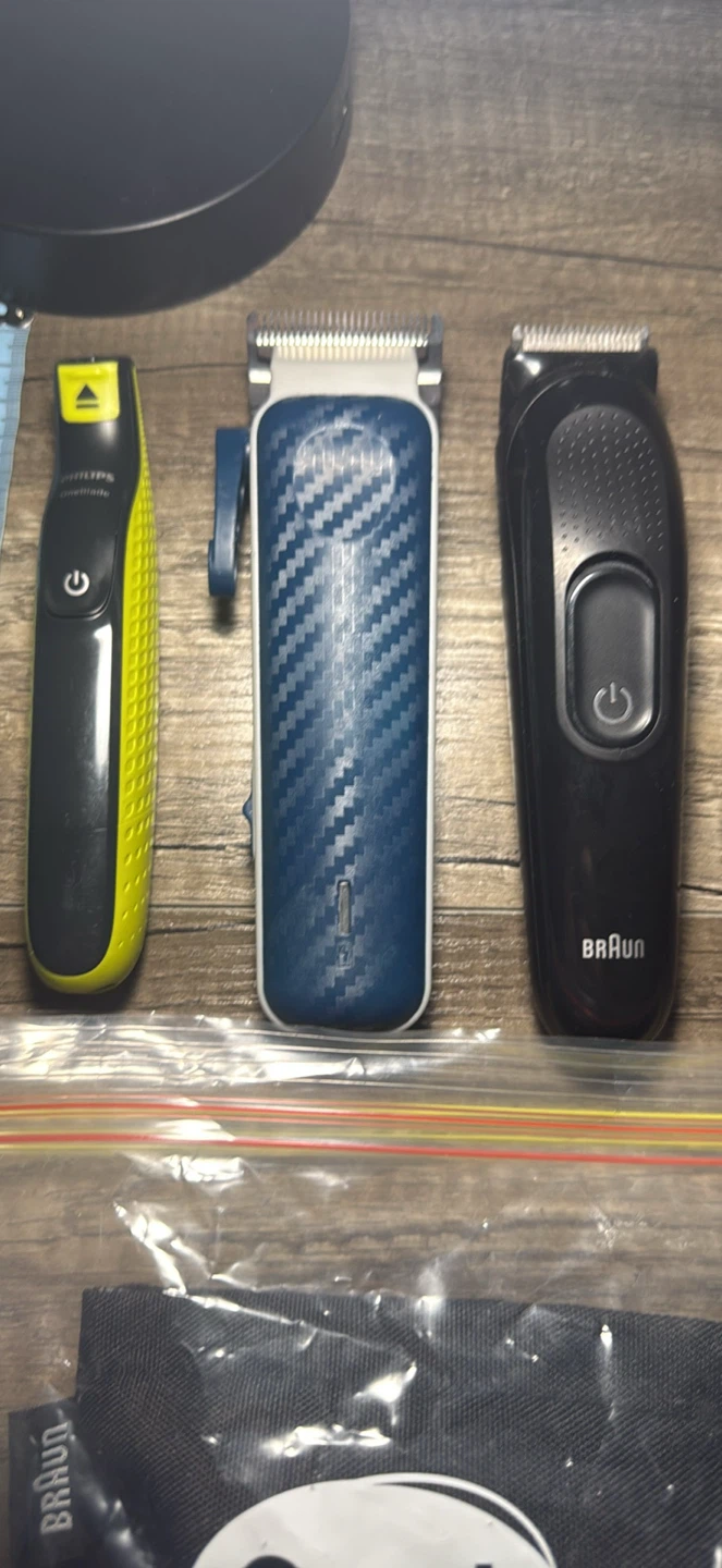 Braun and Philips OneBlade hair trimmers with attachments