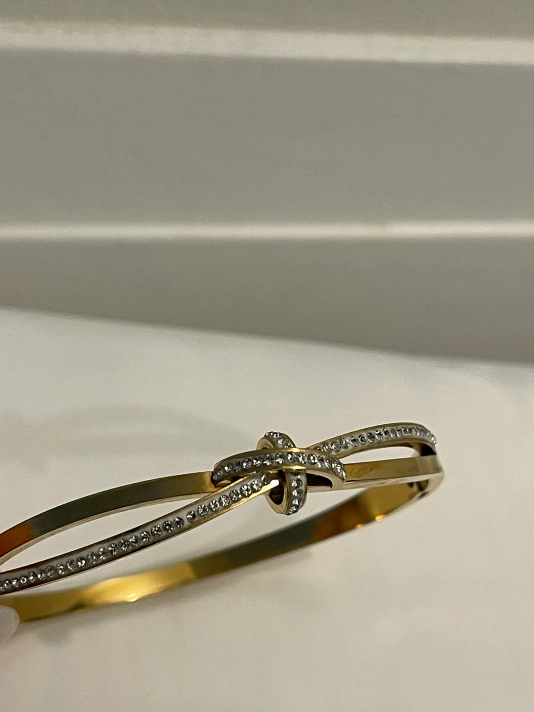 Gold-tone knot bracelet with crystals