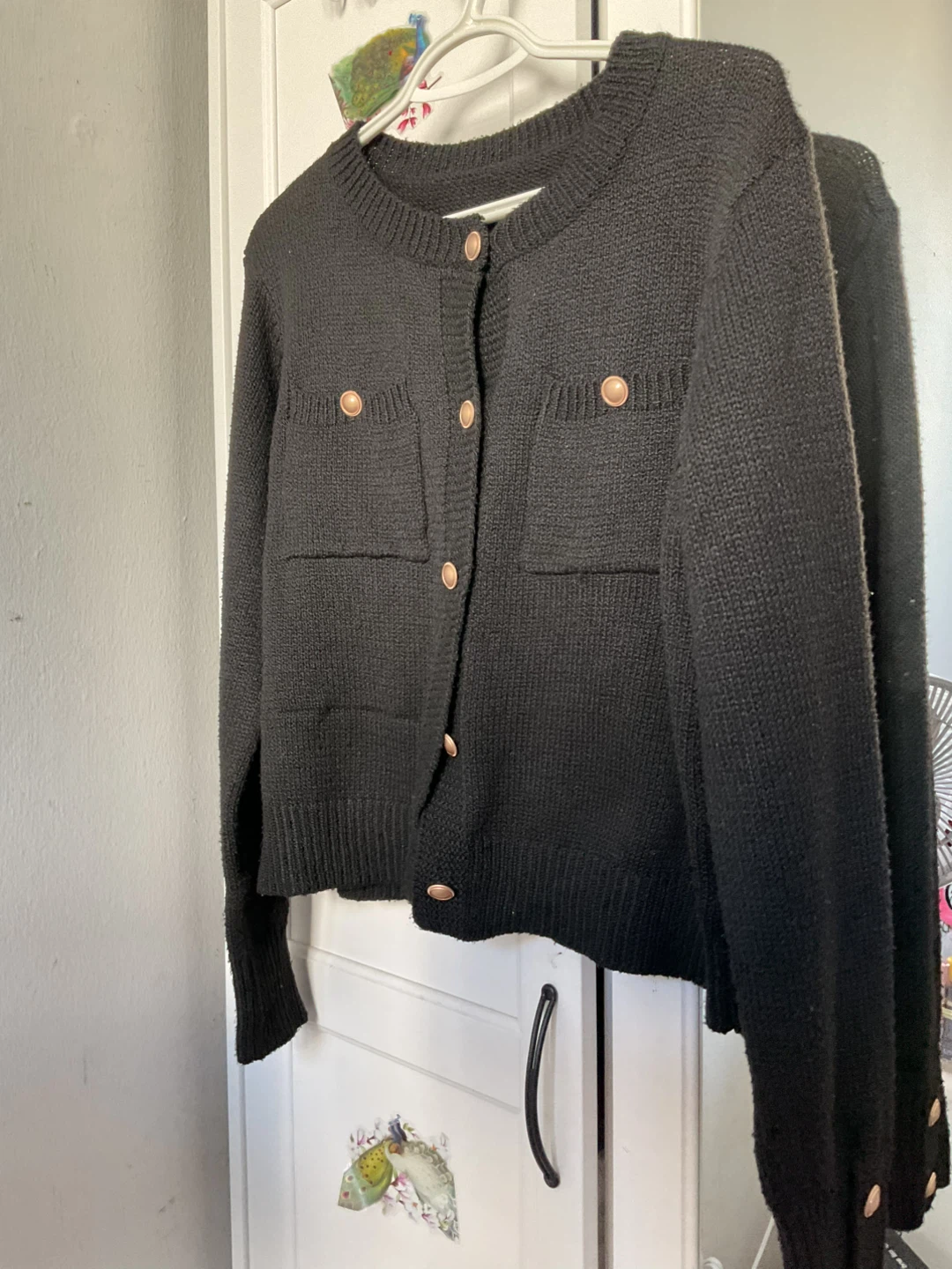 Black knit cardigan with gold buttons