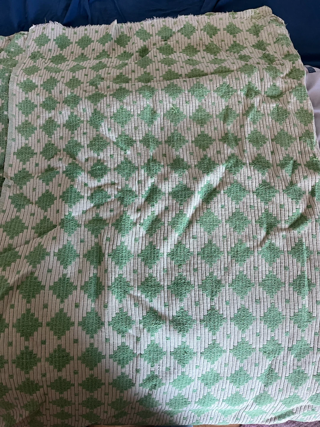 Green and white geometric print throw blanket