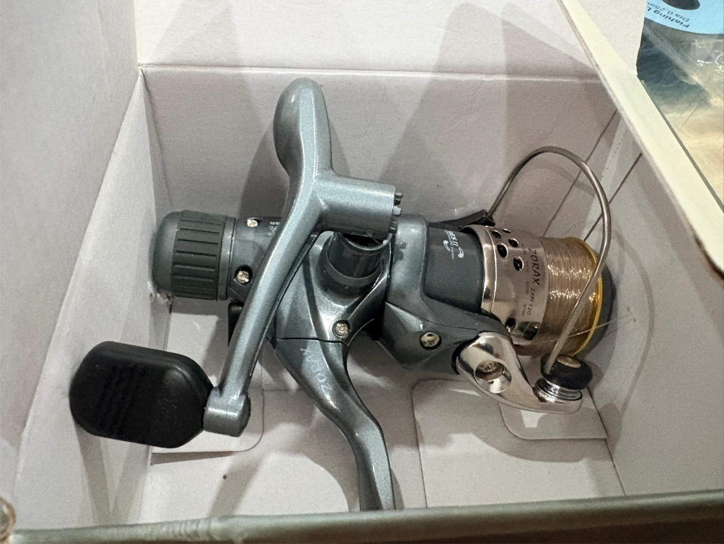 Okuma Zorax ZXR 120 Fishing Reel and Blue Fox Lure Set