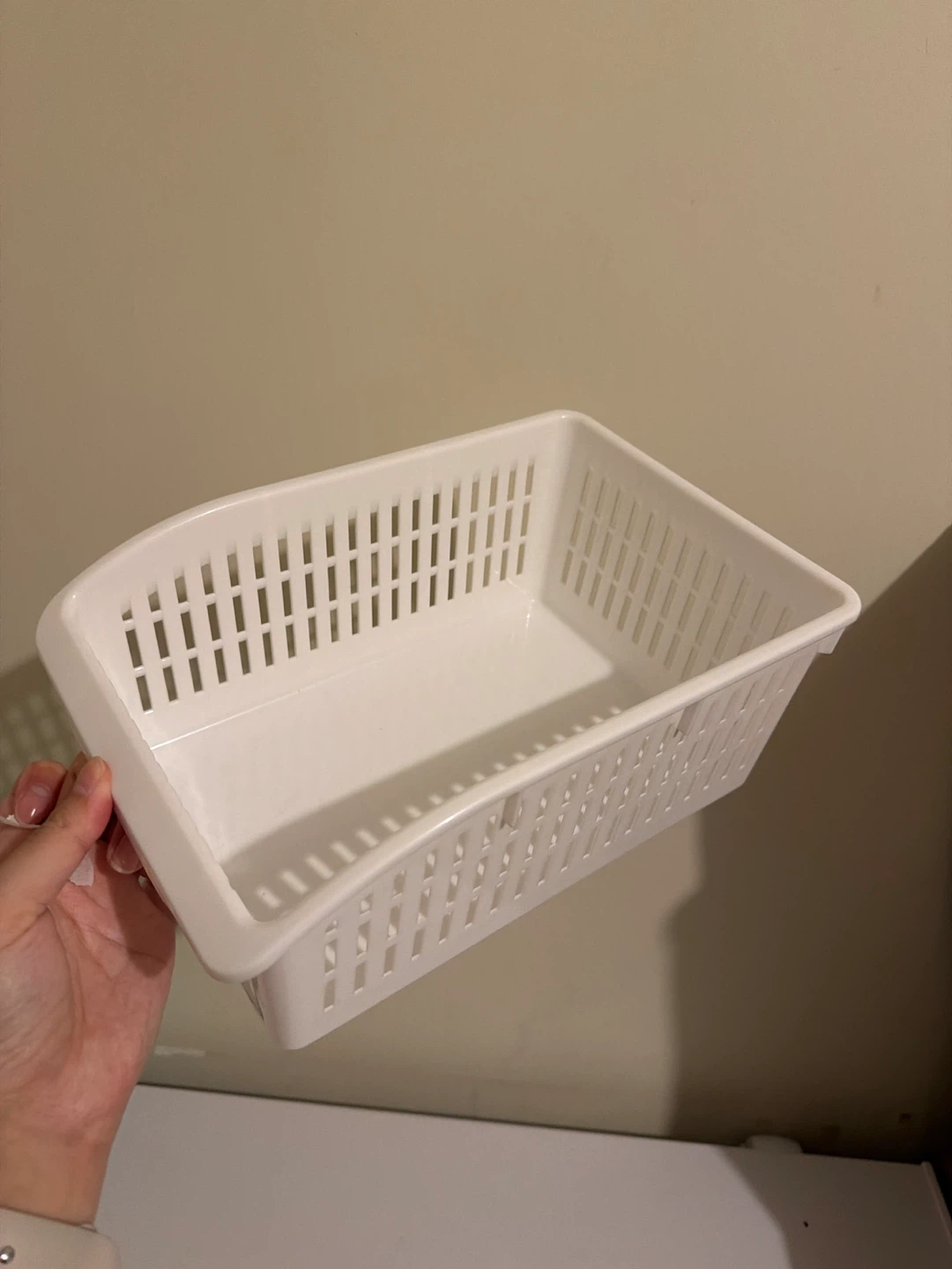 White plastic storage basket