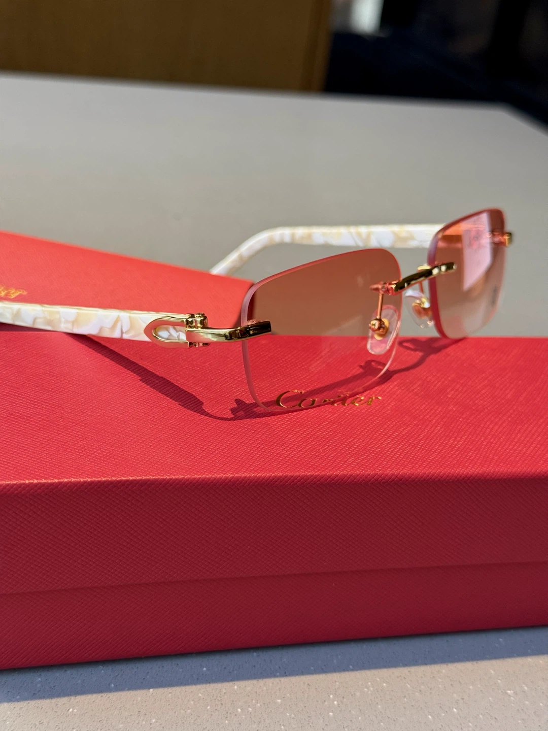 Cartier rimless sunglasses with red case