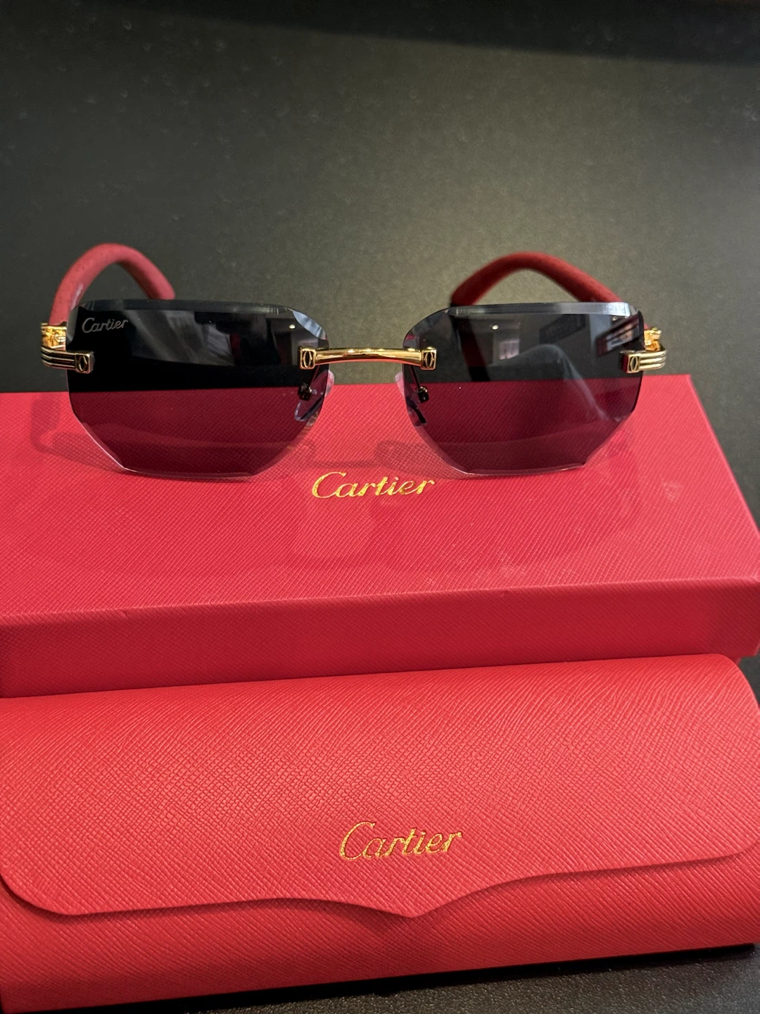 Cartier rimless sunglasses with red wood-finish temples