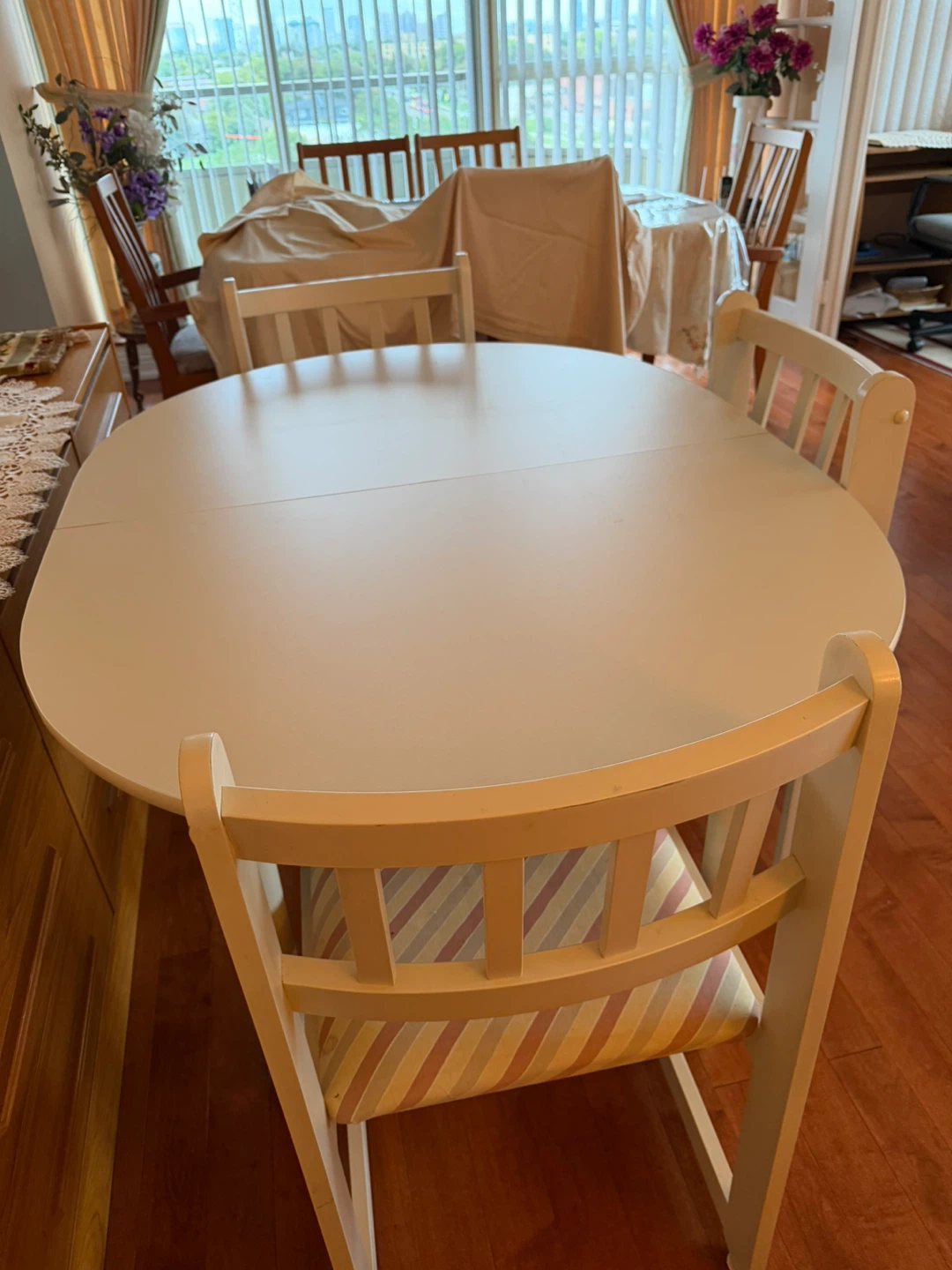 Oval wooden dining table and chairs set