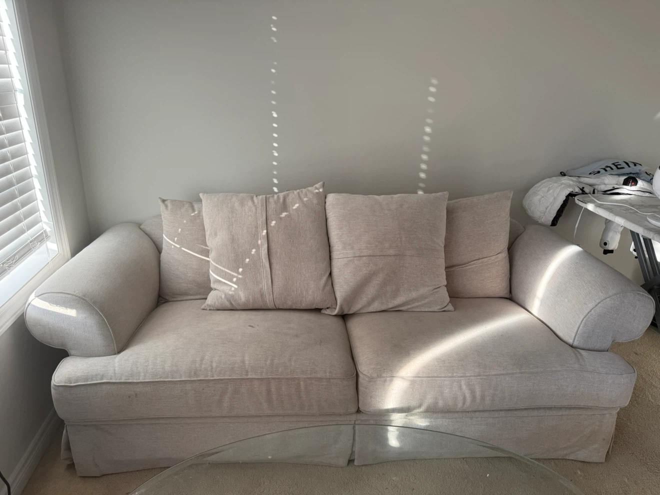 Beige two-seater sofa