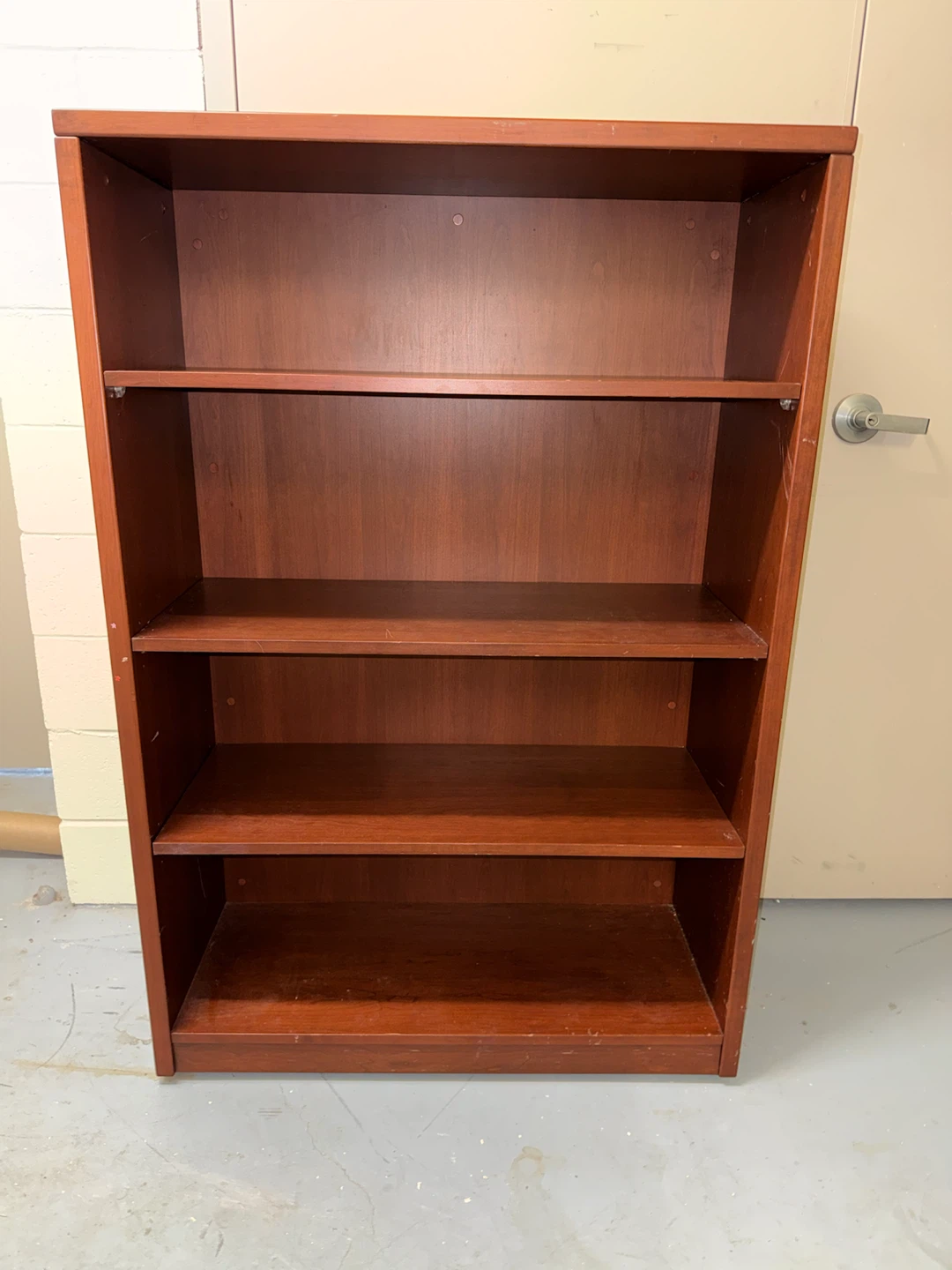 Tall brown wooden shelf