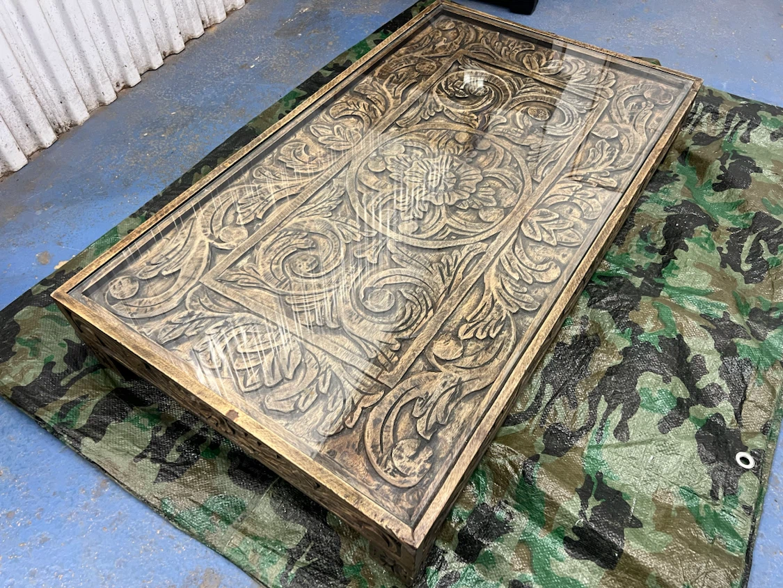 Carved Wood Coffee Table with Glass Top