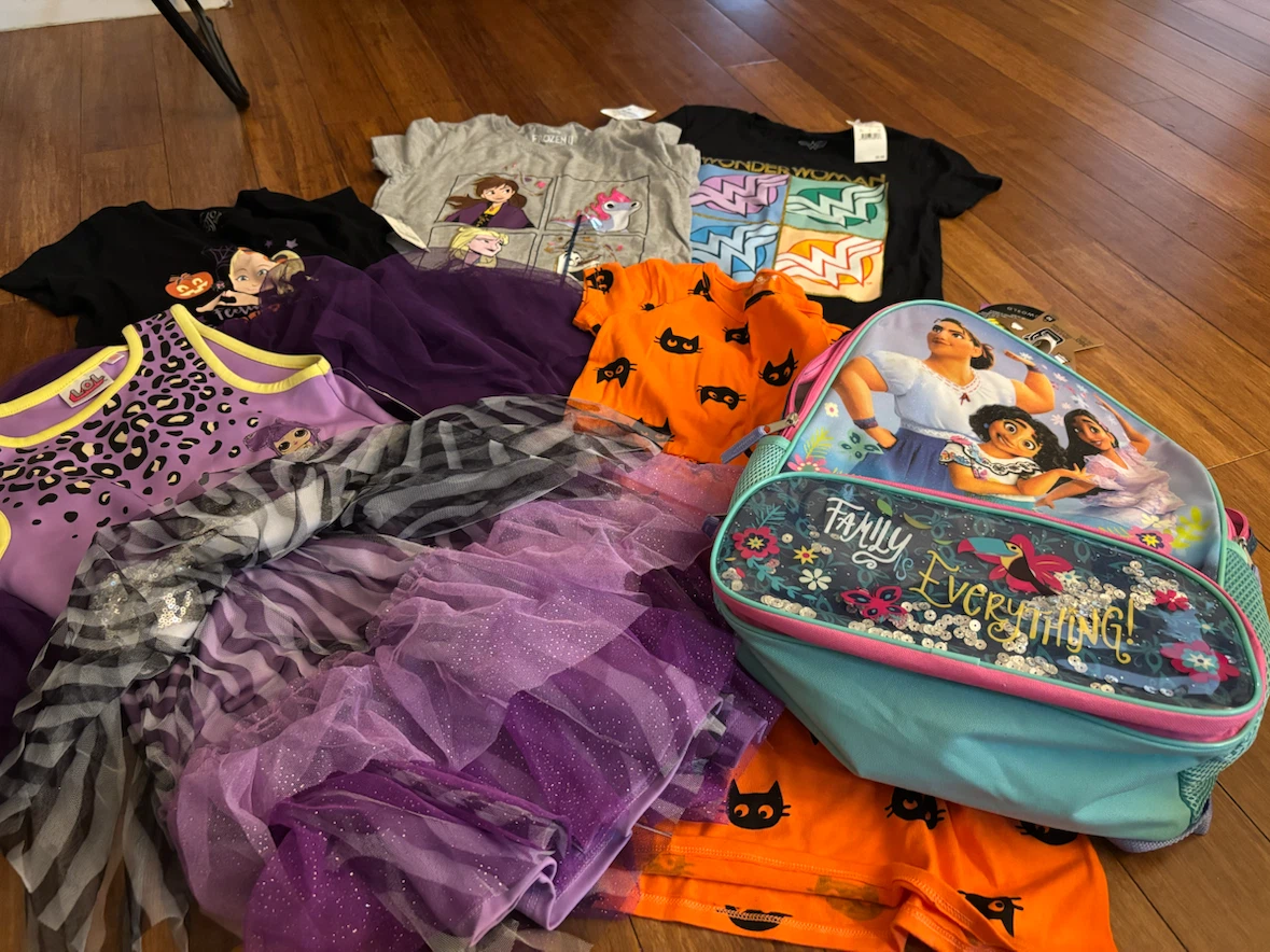 Brand new with tags clothes and book bag