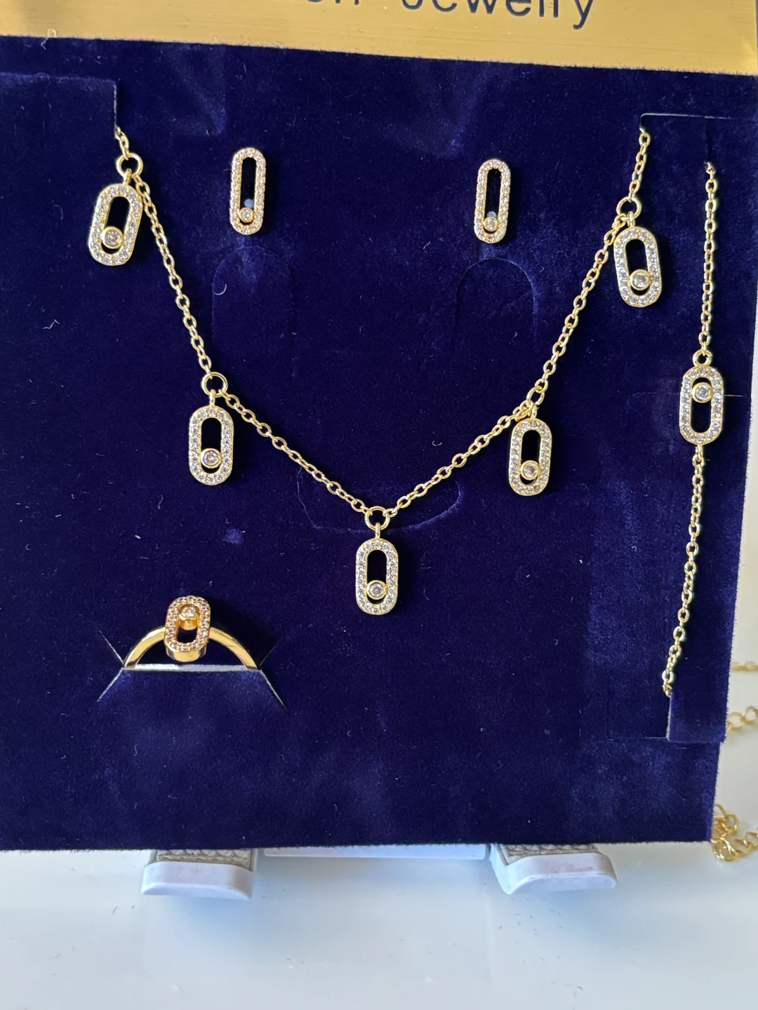 Gold-plated tone jewelry set with oval accents