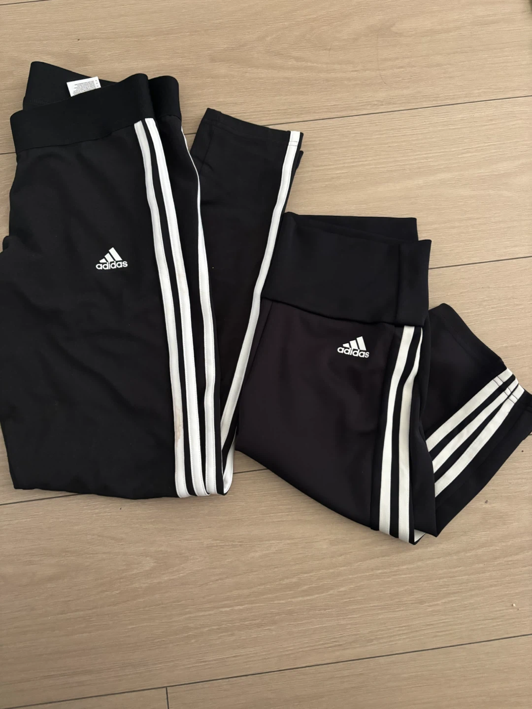 Two pairs of black Adidas leggings