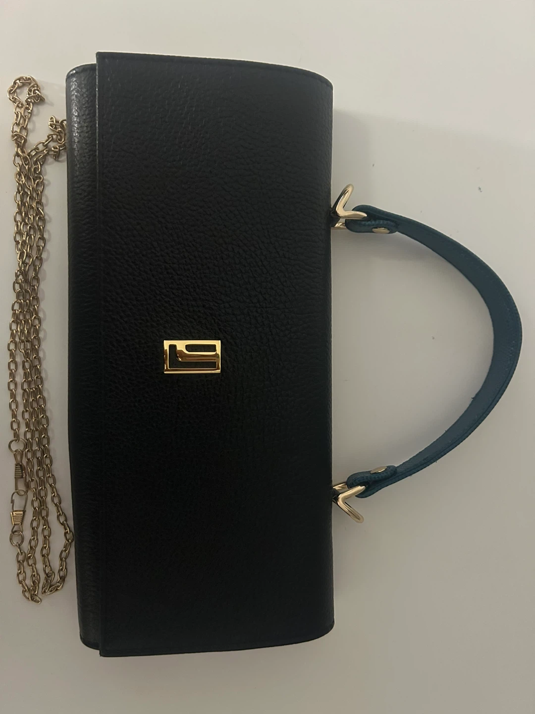 Black clutch with gold chain