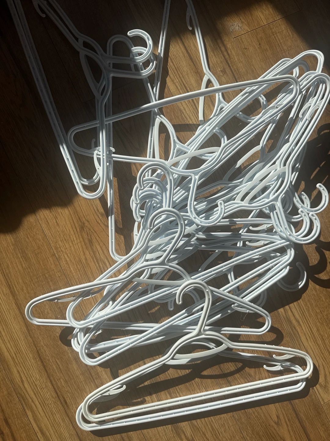Set of White Plastic Clothes Hangers