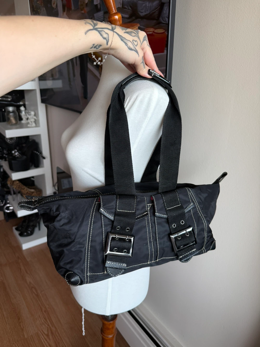 Black nylon shoulder bag with buckle details