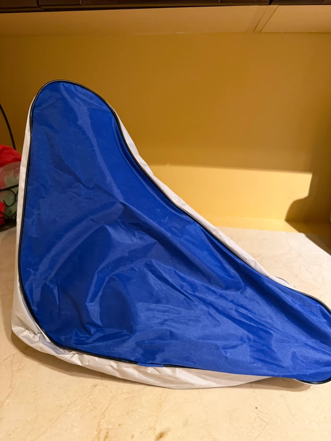 Blue and grey triangular skates bag