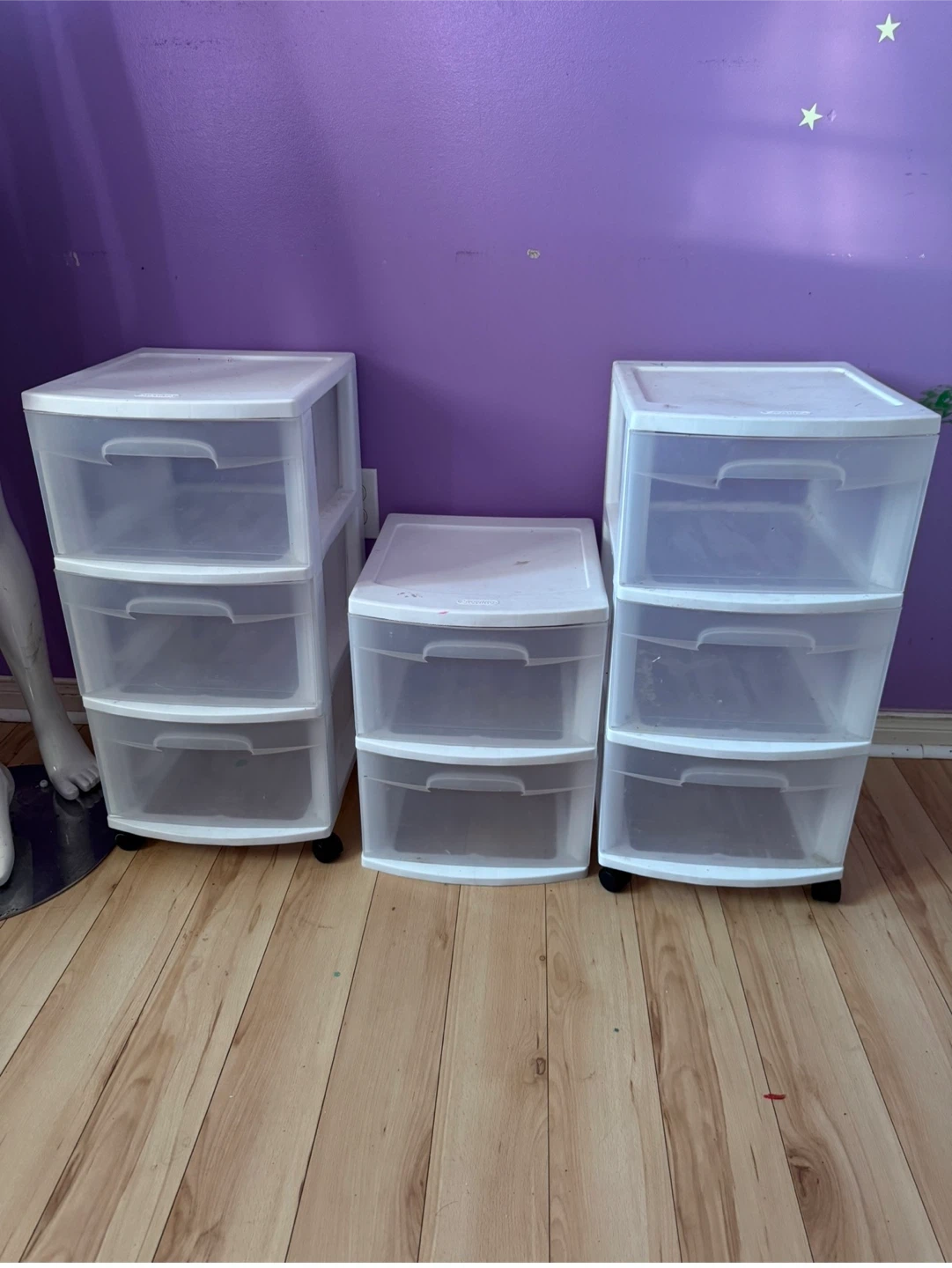 Set of 3 plastic drawer storage organizers with clear drawers.