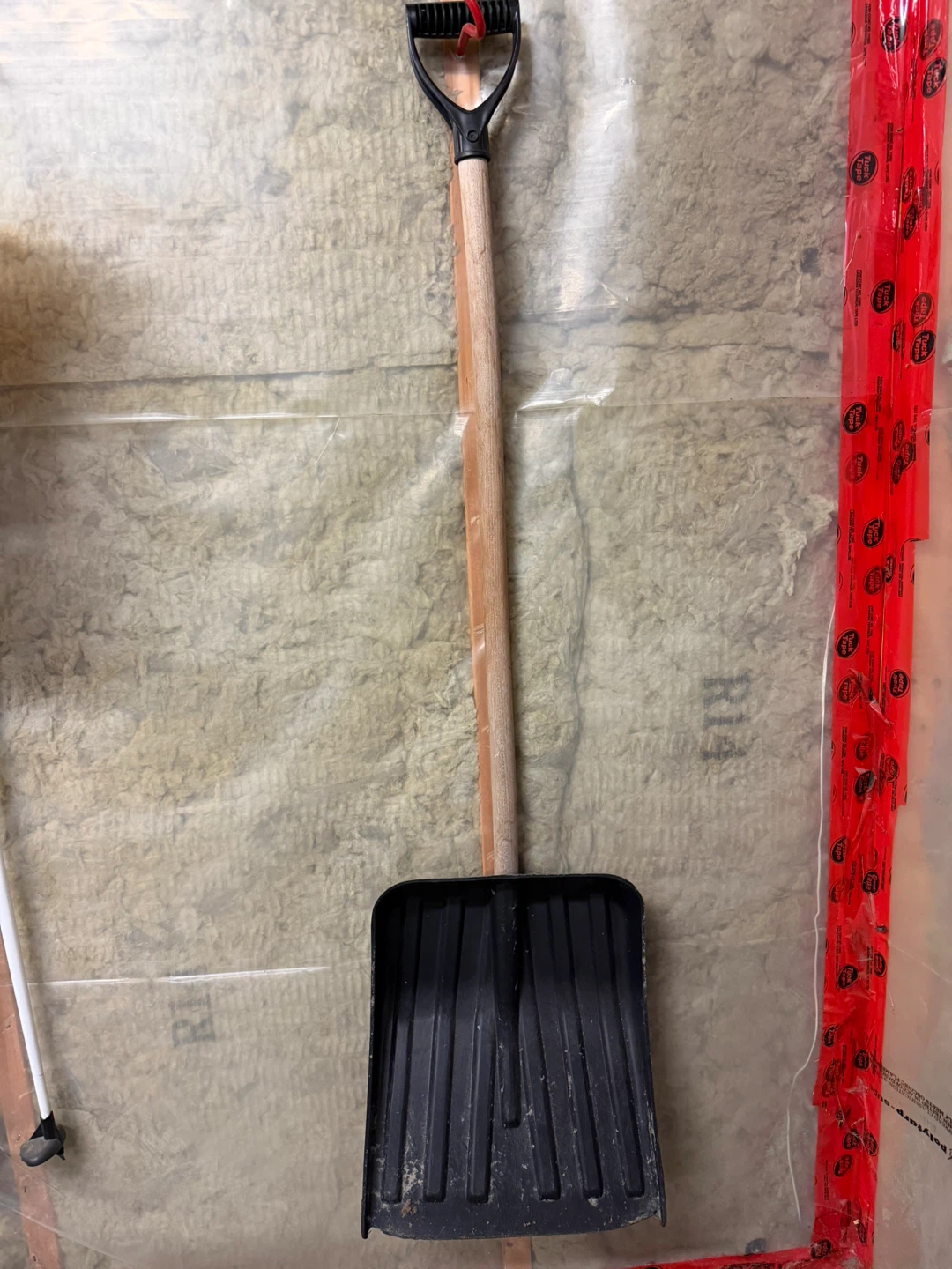 Snow shovel with wooden handle
