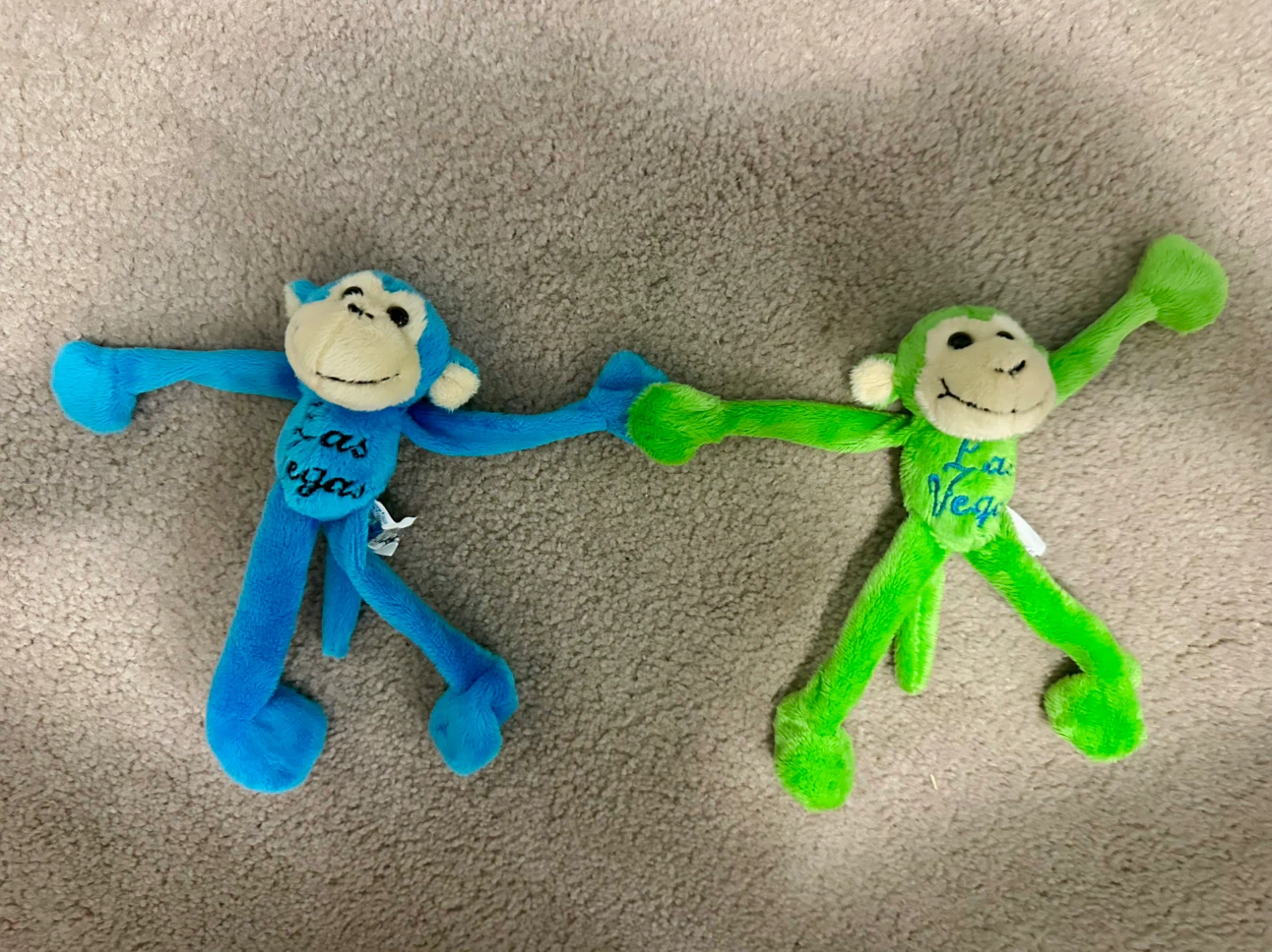 Two Las Vegas Plush Monkeys