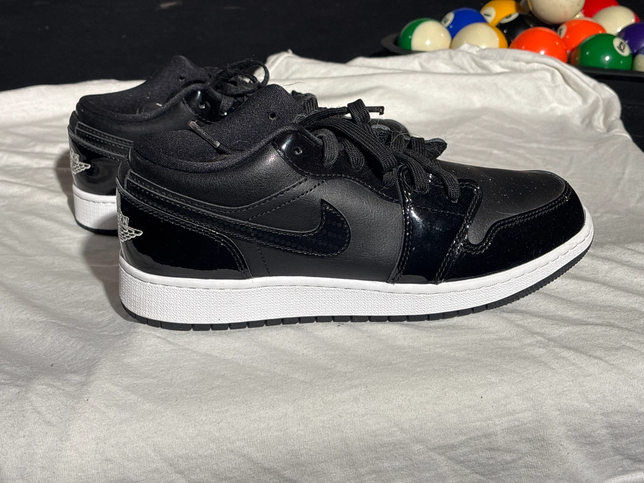Air Jordan 1 Low Black Patent Leather Sneakers
