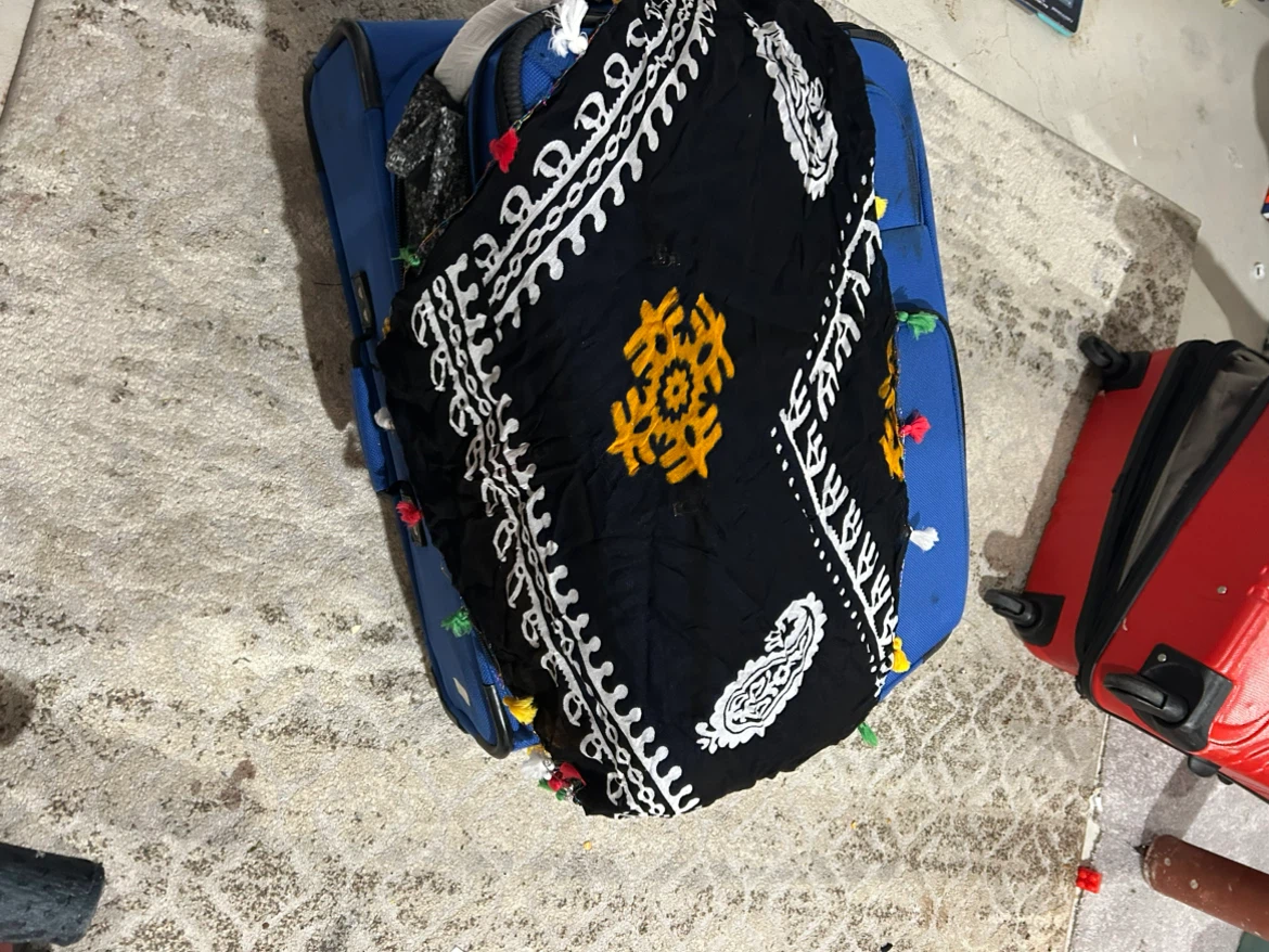 Black and white patterned scarf with tassels