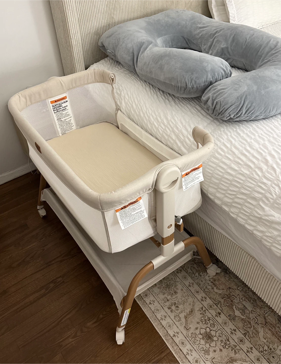 Beige Baby Bedside bassinet with wheels