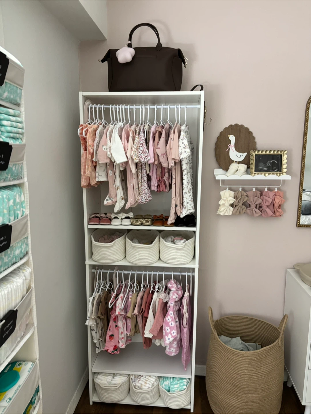 White nursery baby clothing closet/ organizer