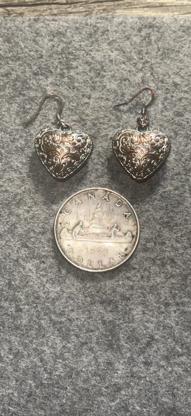 Large metallic heart shaped earrings