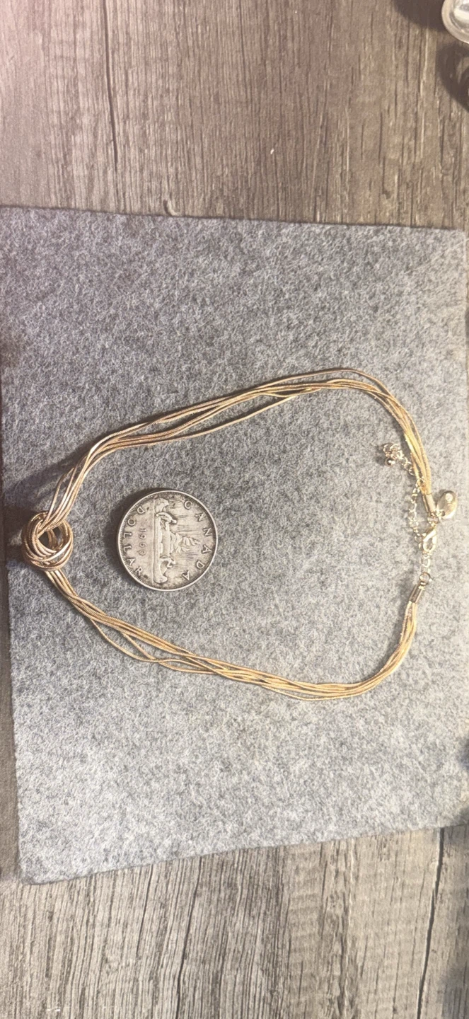 Stranded chains gold tone knot necklace