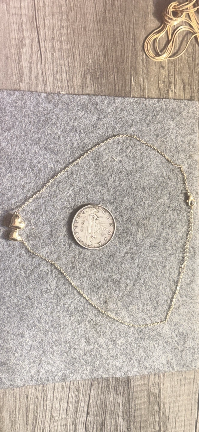 Gold tone chain and heavy heart pendant