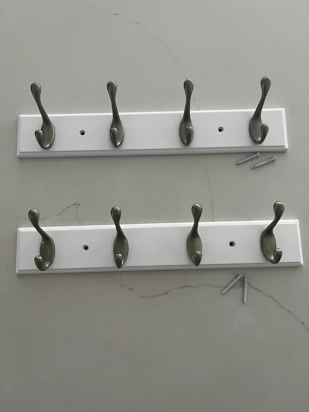 Two White Wall-Mounted Coat Racks