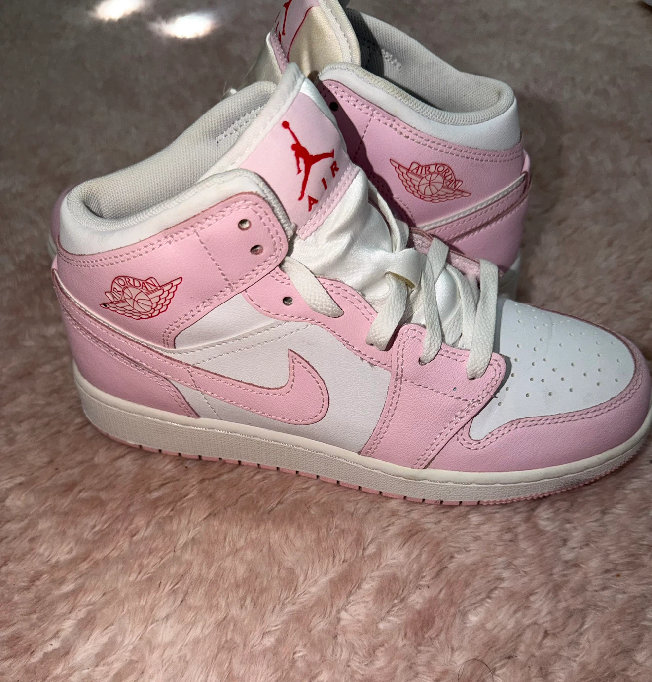 Air Jordan 1 Mid Pink and White Sneakers