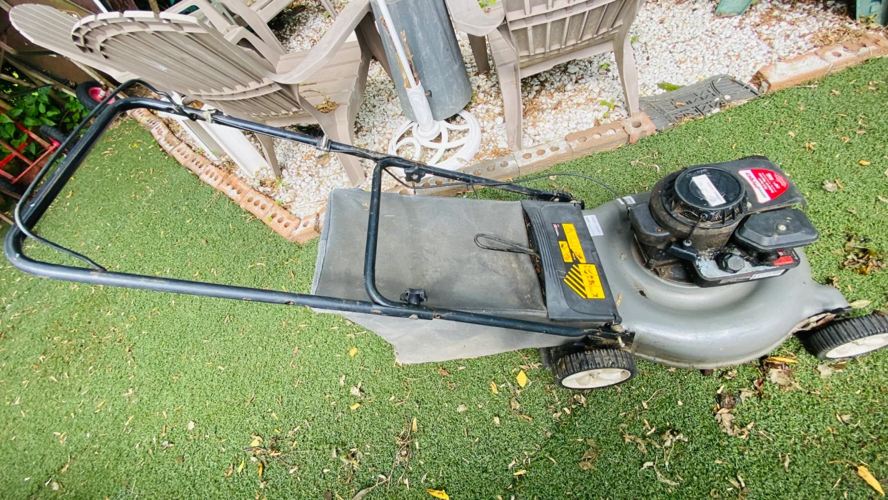 Gas-powered push lawn mower sold as is