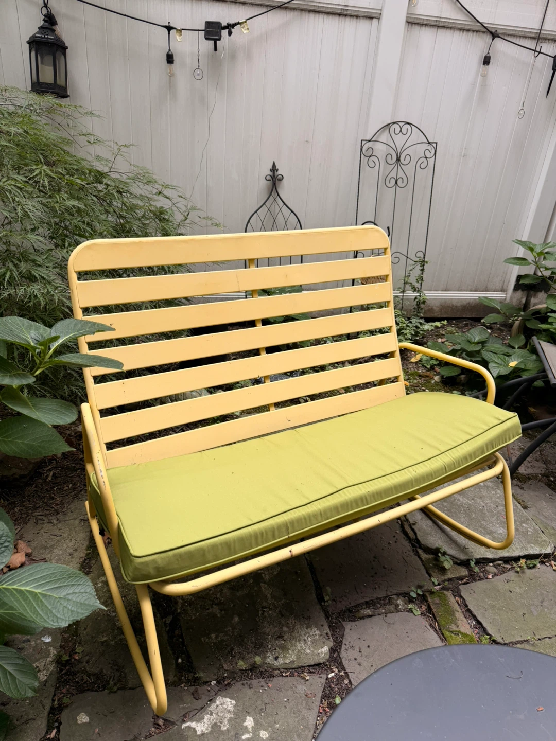 Yellow Metal Outdoor Glider Bench