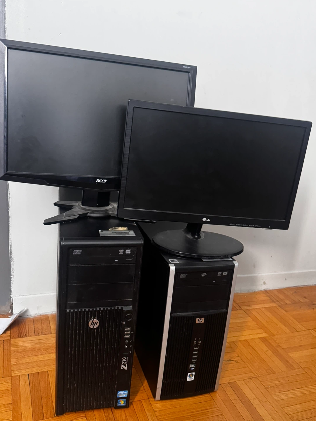 Two HP Desktop PCs with Acer and LG Monitors