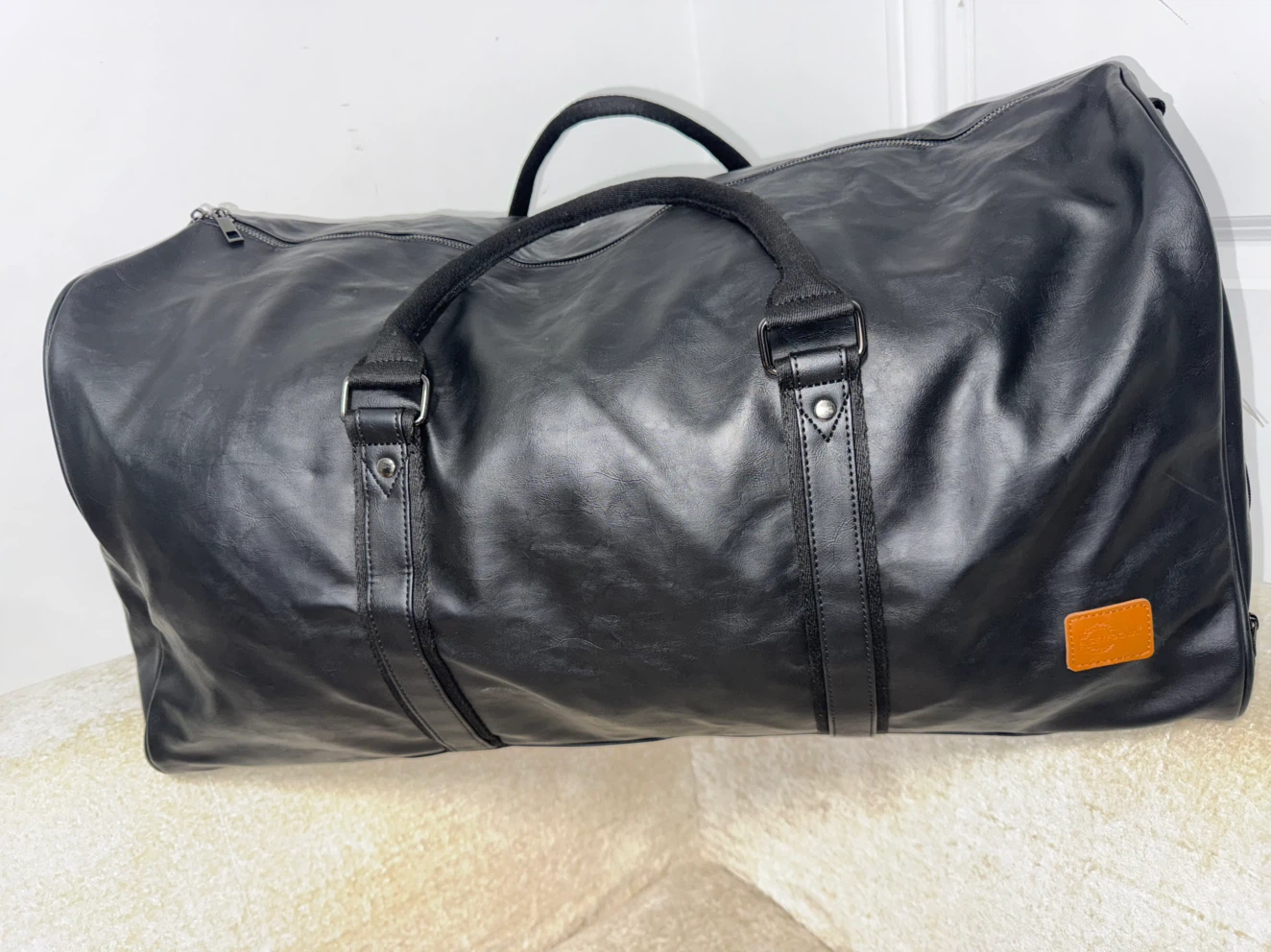 Black Large Duffel Bag with luggage sleeve.