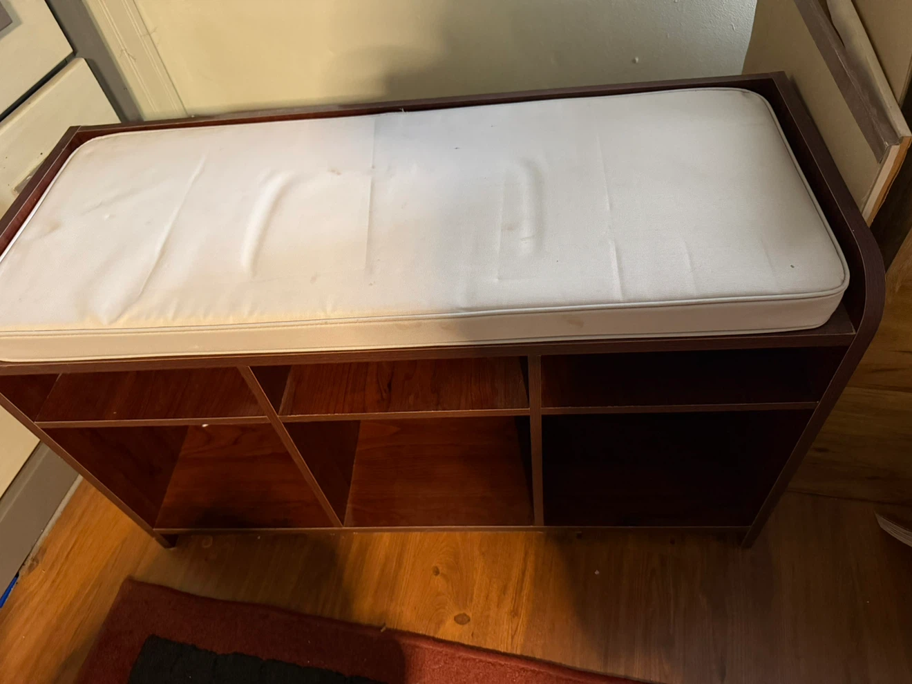 Dark Wood Bench with White Cushion