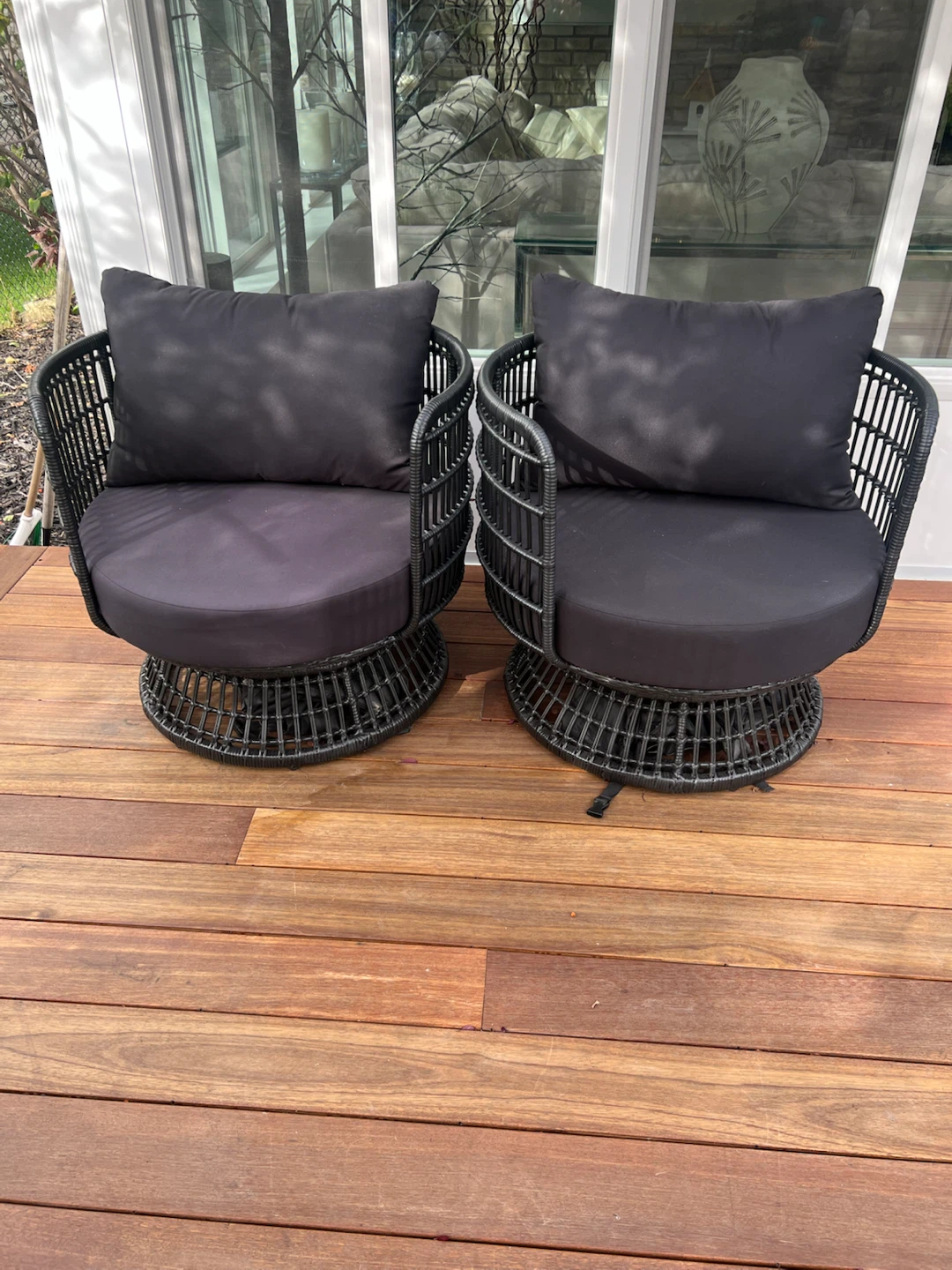Two Black Wicker Swivel Patio Chairs