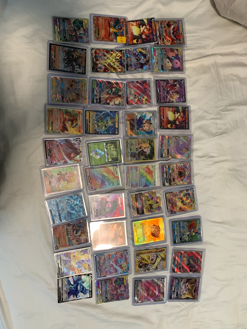 Large Collection of Pokémon Trading Cards in Protective Cases