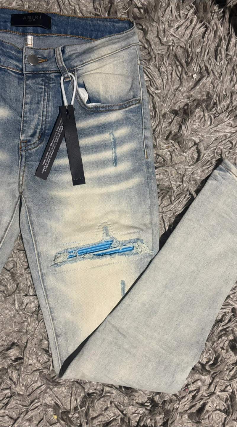 AMIRI Light Wash Distressed Jeans - photo 3