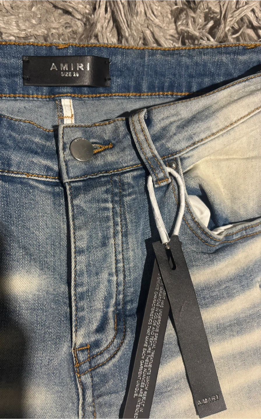 AMIRI Light Wash Distressed Jeans - photo 4