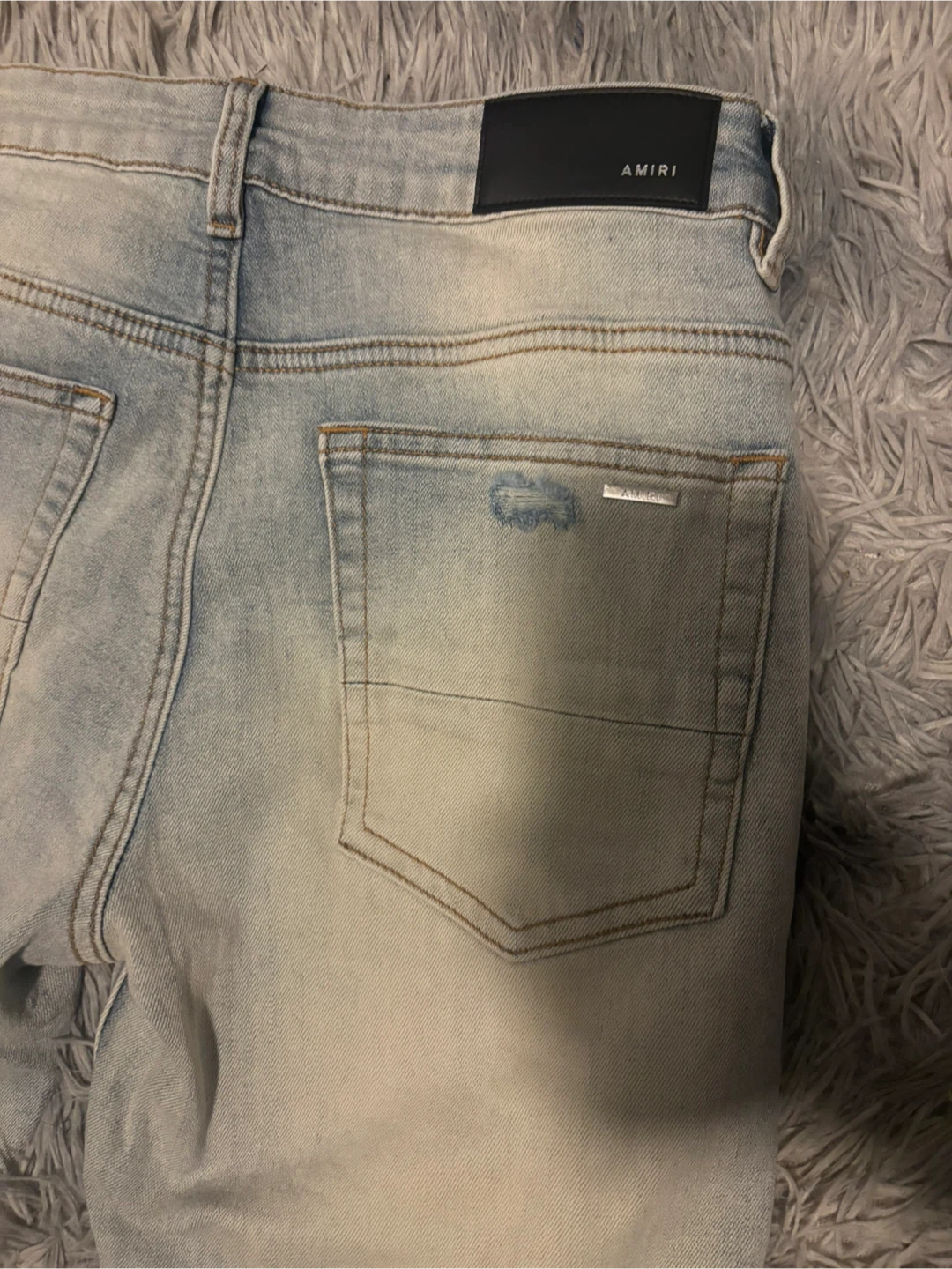 AMIRI Light Wash Distressed Jeans - photo 5