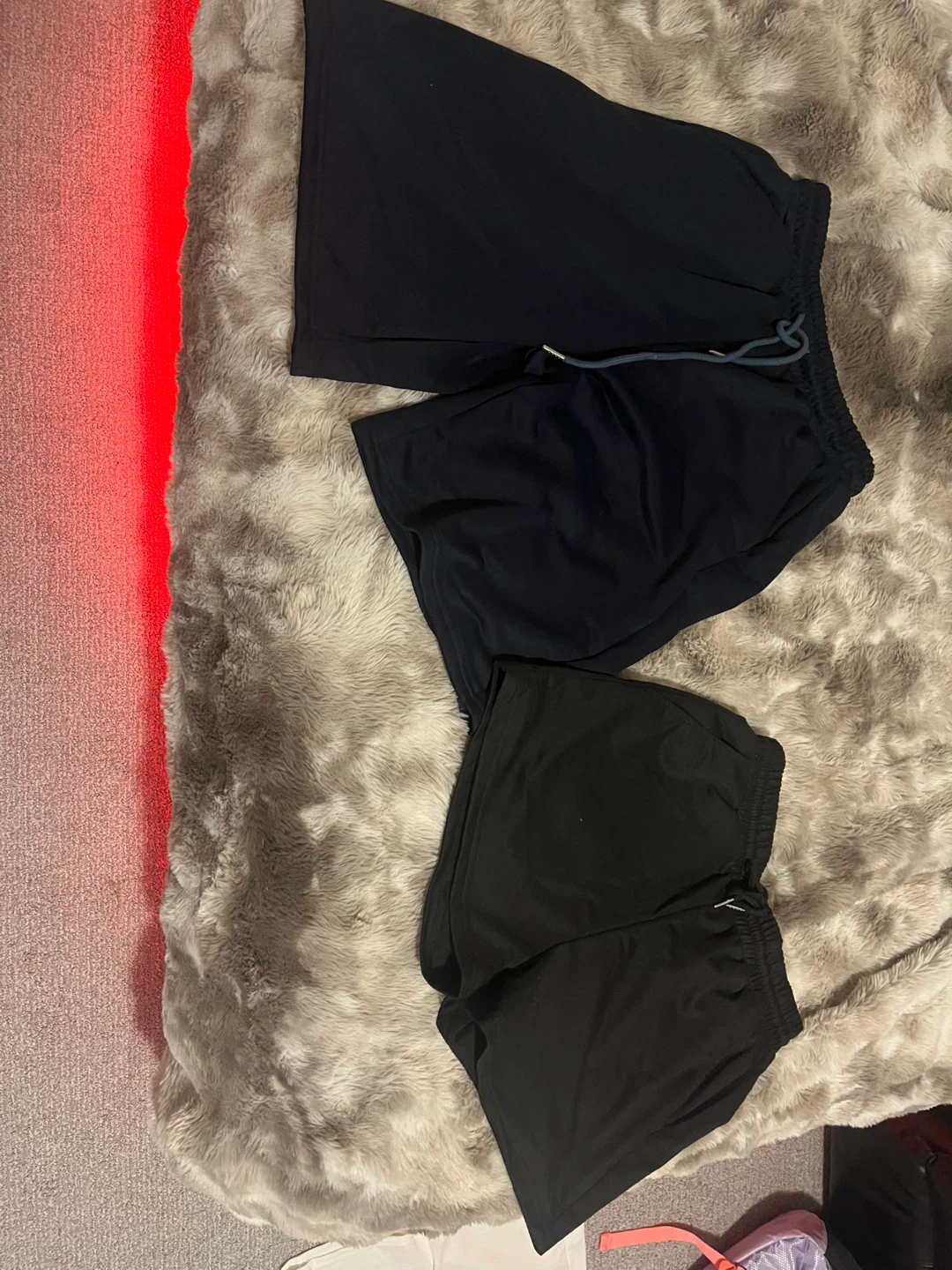 Navy blue long shorts, and black shorts