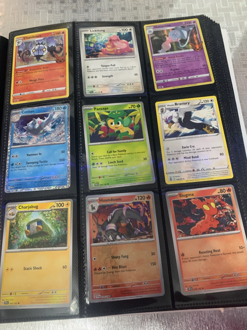 Assorted Pokemon Trading Cards in Binder