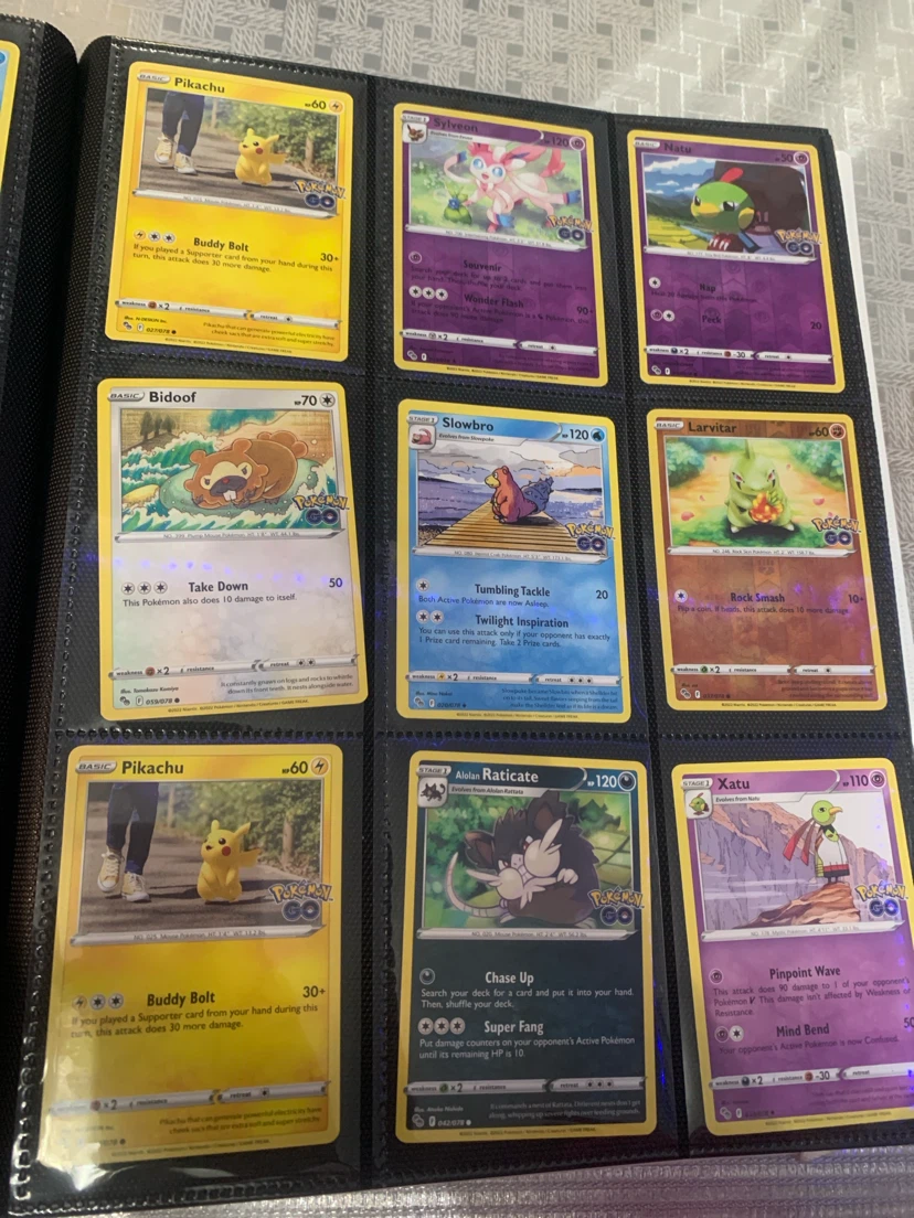 Assorted Pokemon Trading Cards in Binder