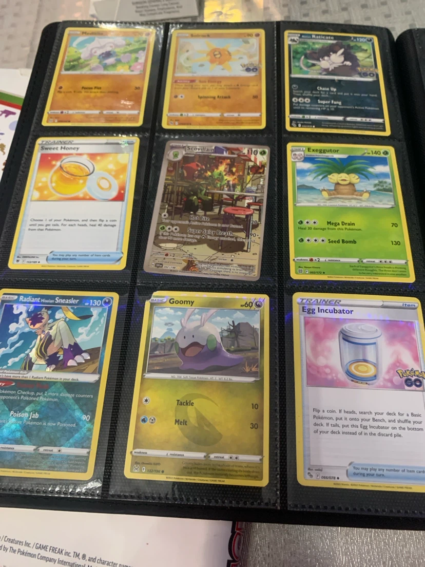 Assorted Pokémon Trading Cards in Binder