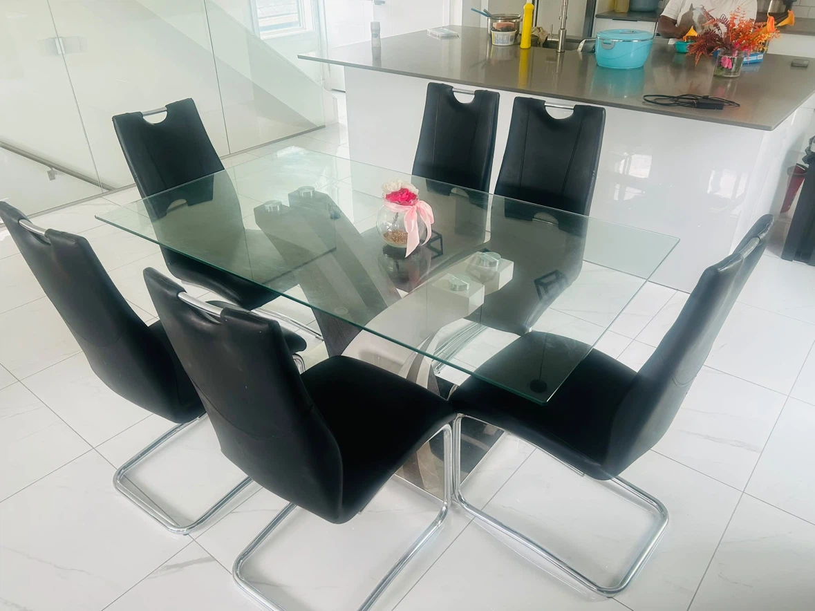 Glass Dining Table with 6 Black Chairs