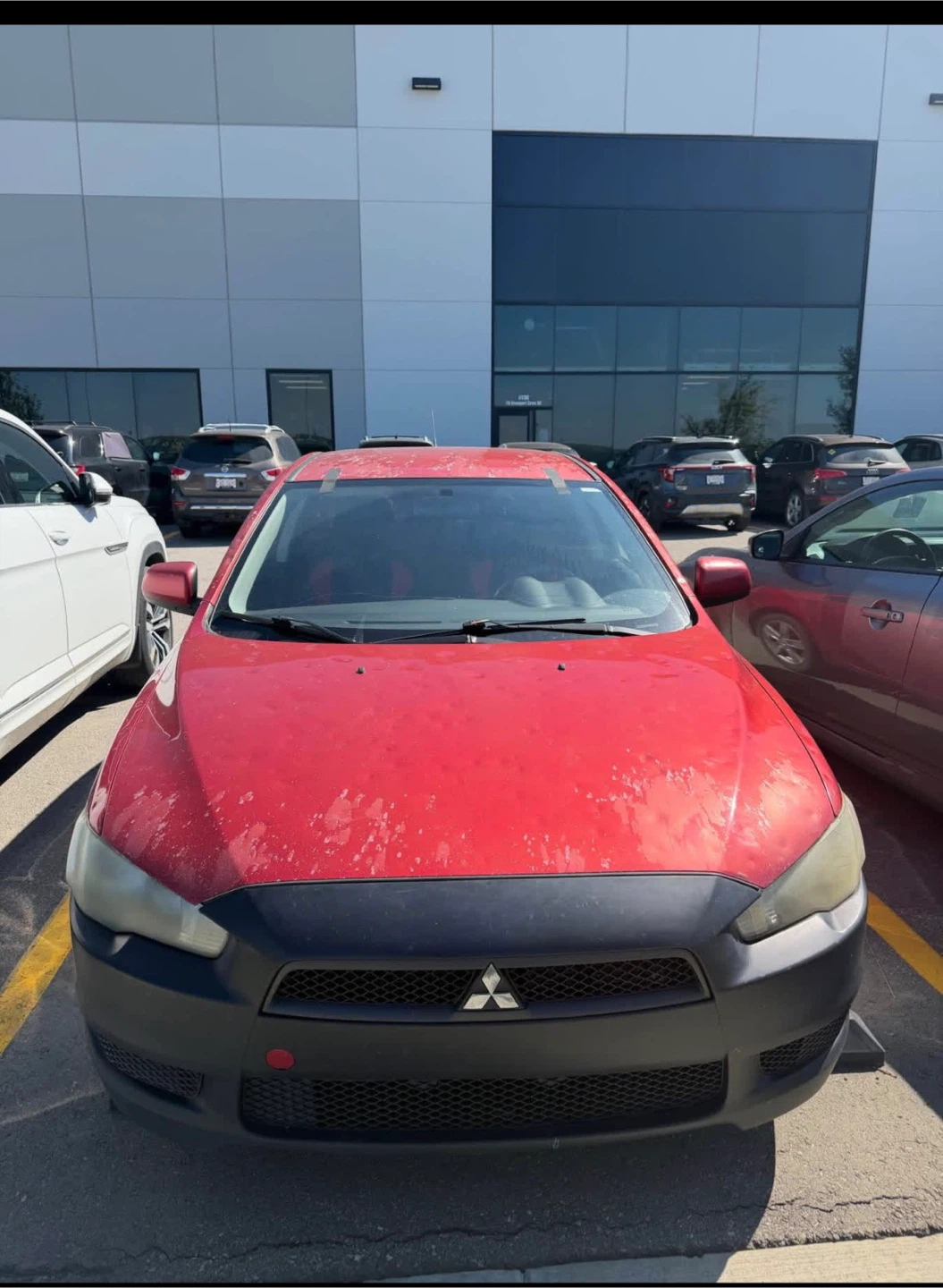 Red Mitsubishi Lancer Sedan