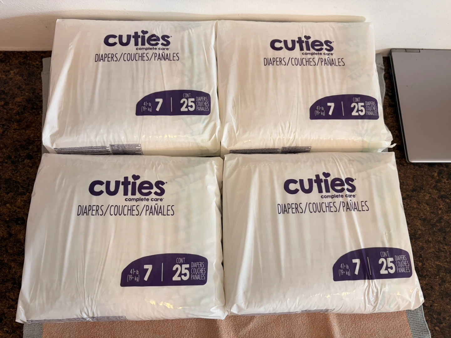 4 Packs of Cuties Size 7 Diapers