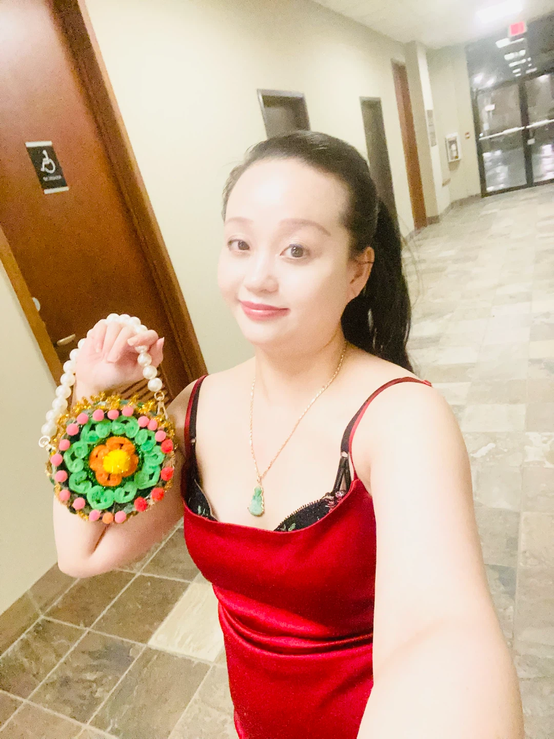 Handcrafted colourful pom-pom circular handbag