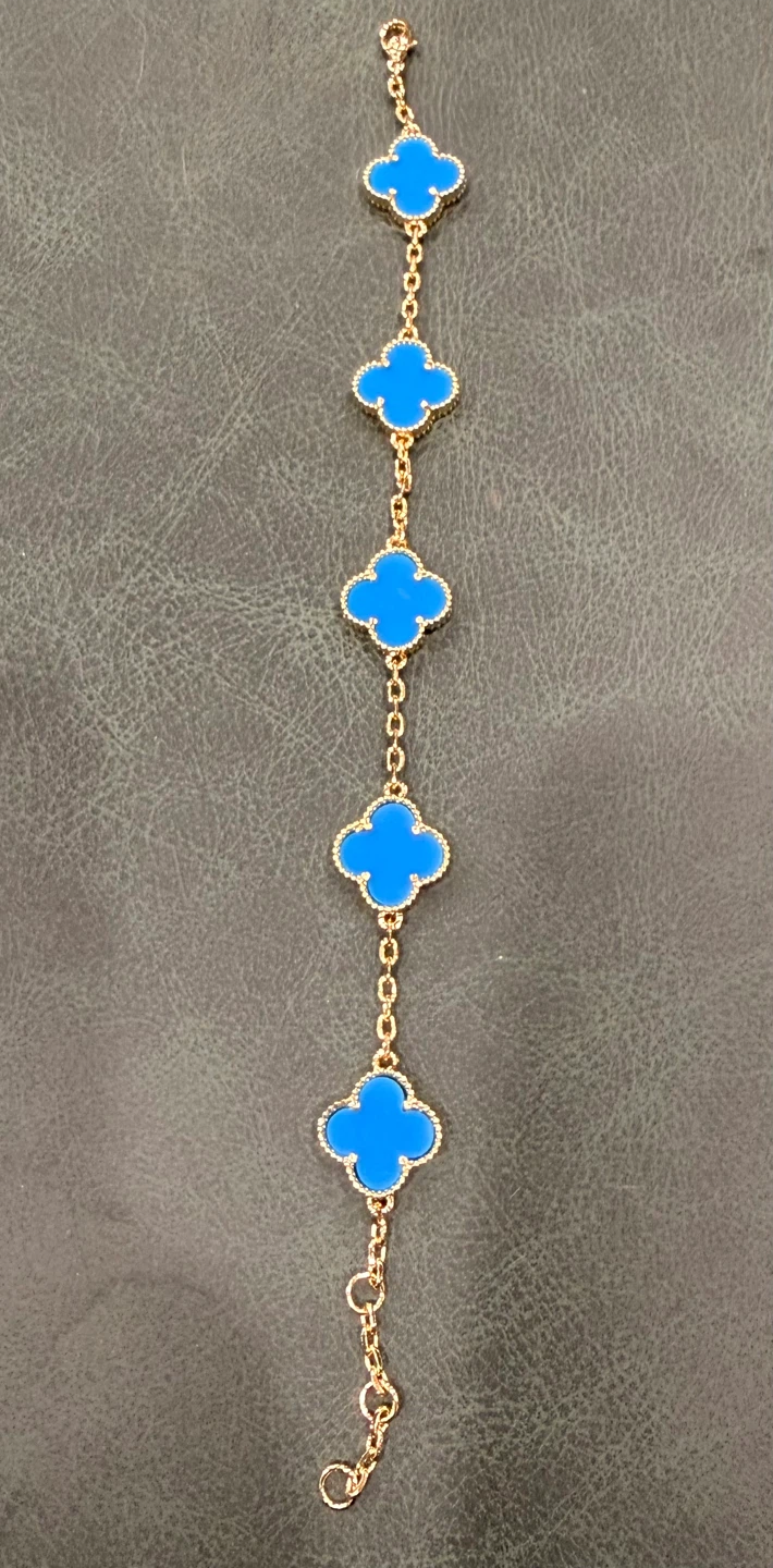 Clover motif gold tone bracelet
